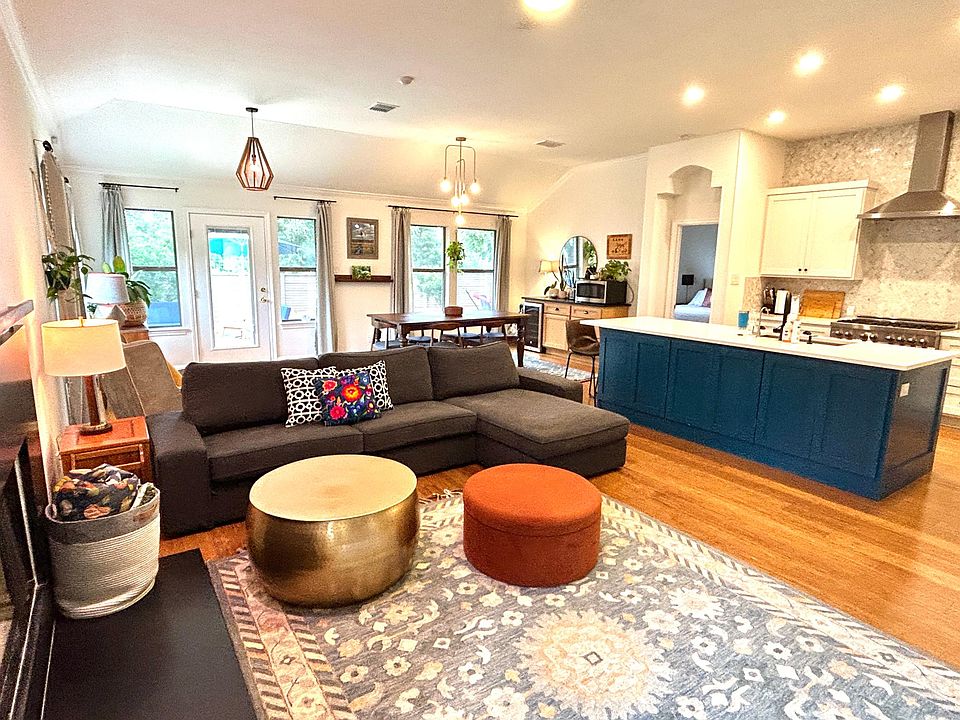 Open Floor Plan with comfort everywhere. The sofa is facing a 61" mounted Samsung TV and Sound Bar