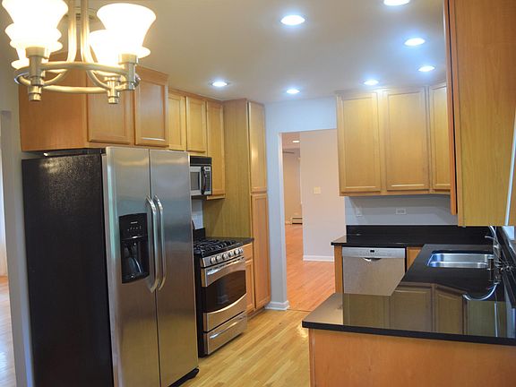 Stainless steel appliances with granite countertops, double oven