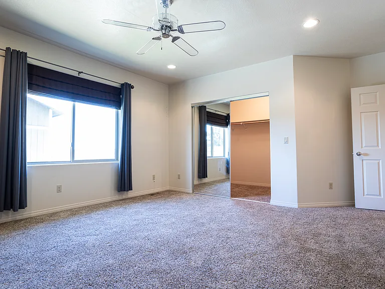 Master closet and window (backyard)