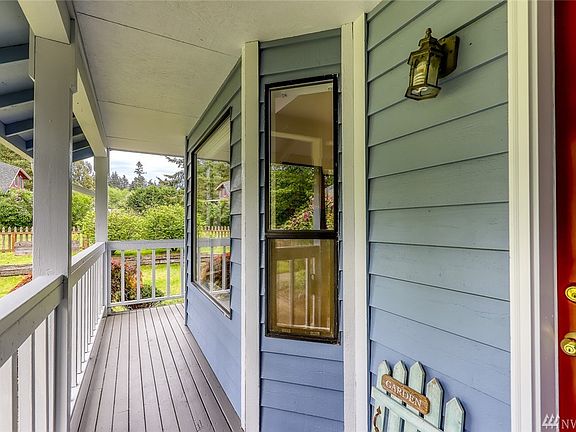 Covered front porch greets you and your guests. 