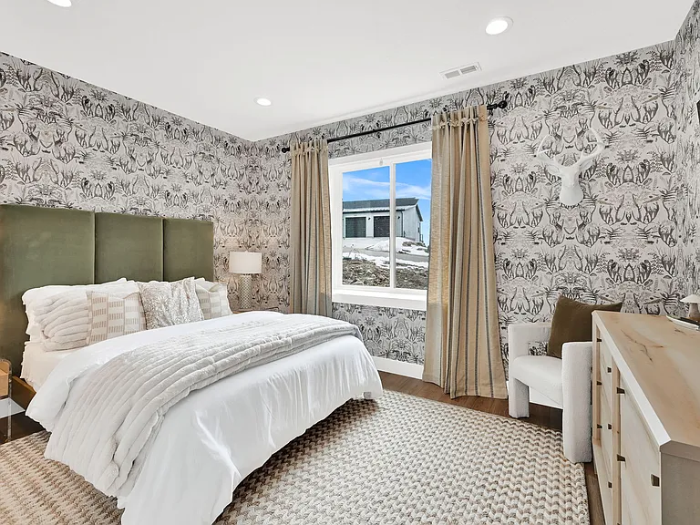 Second downstairs bedroom with queen bed and smart TV