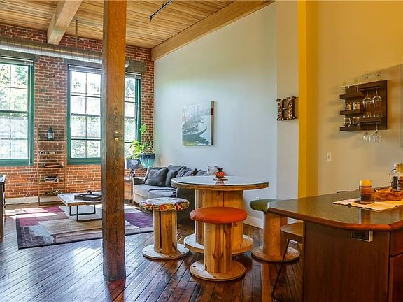 View of the open plan "Great Room" incorporates the living room, a good sized dining space and the kitchen.