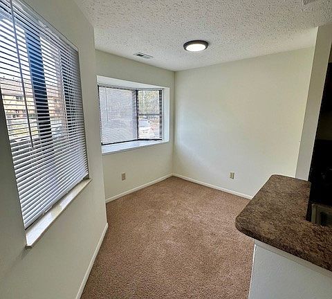 View of the dining area and bay windows in 2201 C