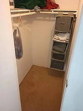 HUGE WALK IN CLOSET TO HANG AND STORE IN MASTER SIZED BEDROOM WITH KING SIZE BED.