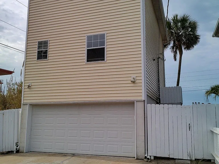 Two-car garage below at rear of home.