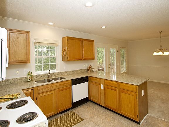 Open living is enjoyed between the kitchen and the breakfast room. 