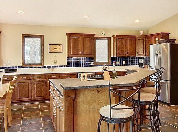 Huge granite island & tons of cabinetry.