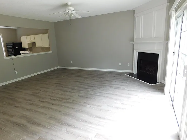 Living room with wood floor and French sliding doors on your right
