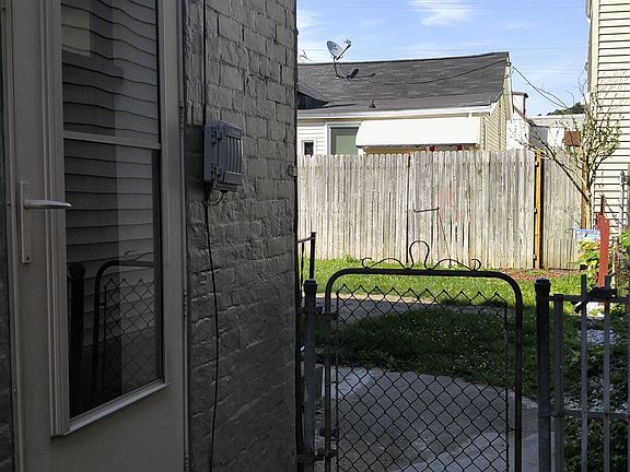 Take the side yard to your private entrance in the backyard.