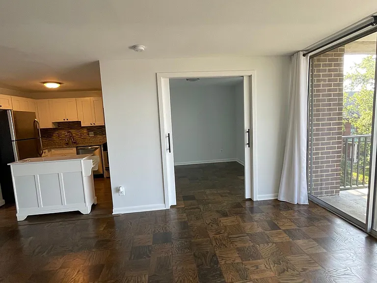 Sliding doors lead to second bedroom.