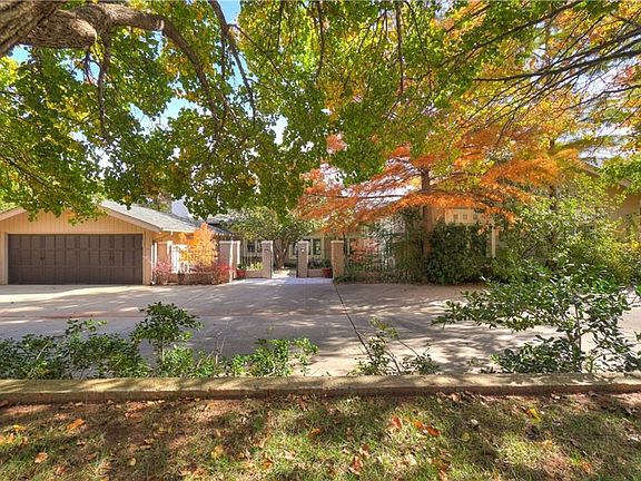 The large wide driveway gives you tons of room for cars and visitors. The courtyard is central to the home - you can enter the front door or the door into the mudroom. There's additional parking to the side of the garage, as well.