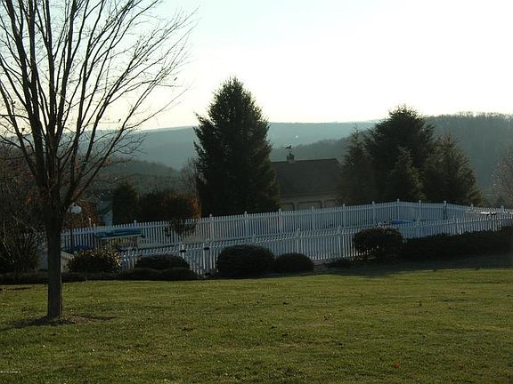 20X40 INGROUND POOL WITH HEATER TO EXTEND YOUR SWIMMING SEASON. NOTE! MOUNTAIN VIEW IN BACKGROUND