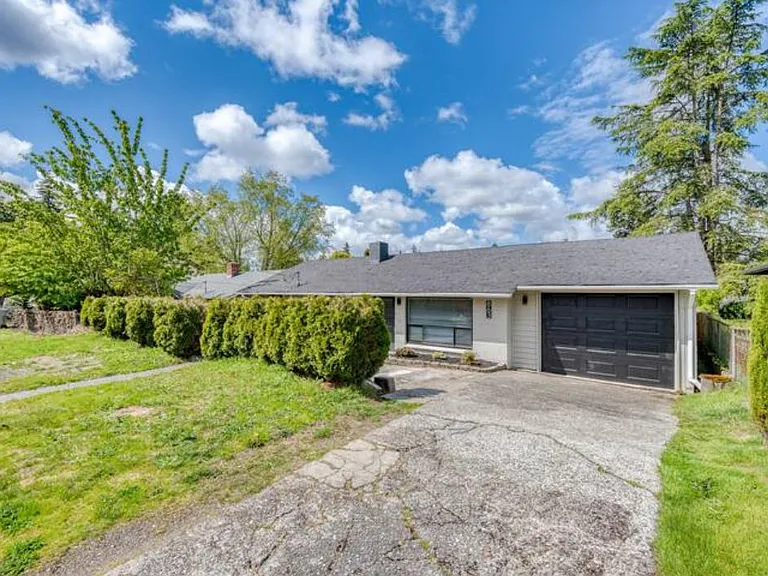 Another view of the house. Parking in the garage, driveway and street