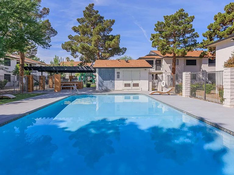 Experience serene moments by the pool in this vibrant community setting.