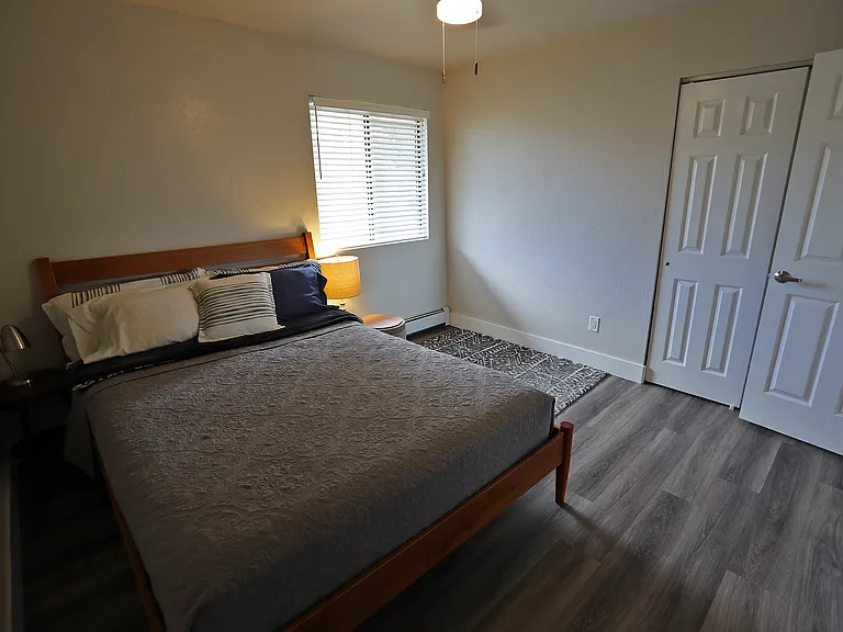 Spacious bedrooms with large window for natural light, full size closet and ceiling fan