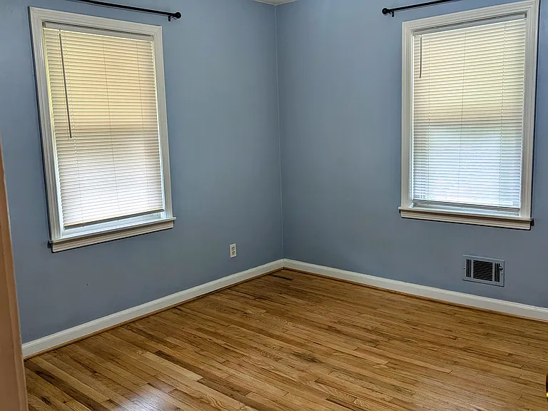 The back bedroom is a bit smaller than the main, but offers additional closet space.