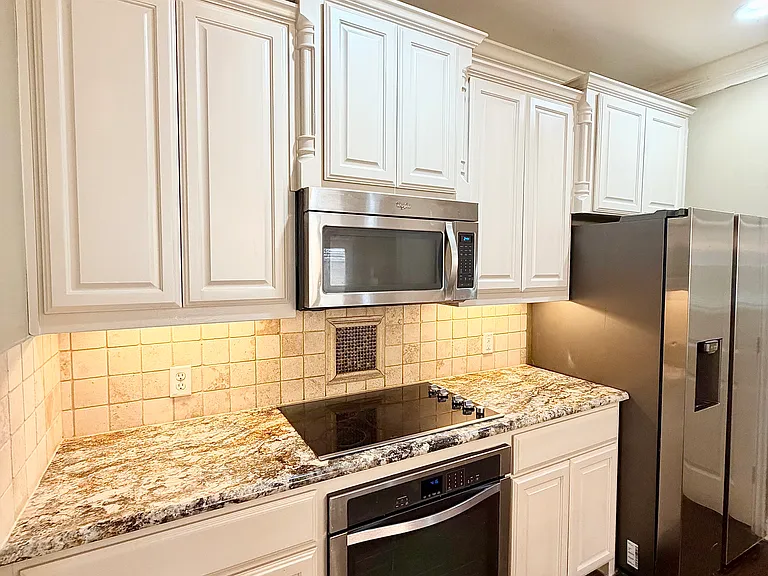 Kitchen with refrigerator included