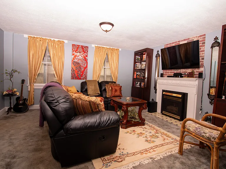 Living room has a working gas fireplace