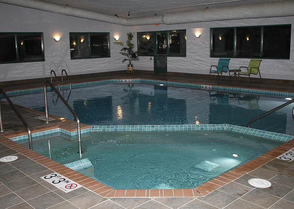 Indoor Heated Pool And Whirlpool, With An Exterior Outdoor Patio, With Gas Grills Included.