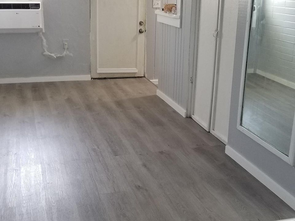 This is your living room area. The rear entrance door opens to your parking area.