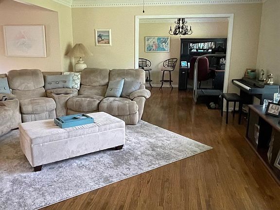 Den off the Foyer with opening to Dining Room