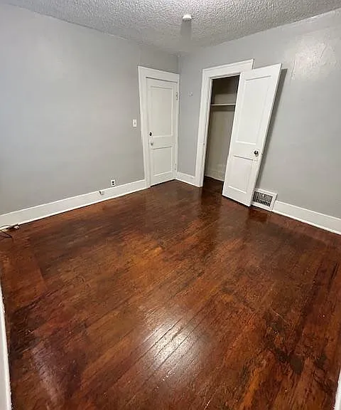 Bedroom #2: Standing in opposite corner looking at the door and the closet.