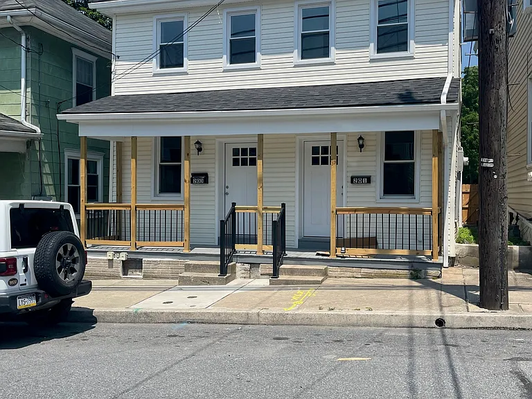 This is a duplex. 201 W High st is on the right and 203 W High St is on the left.