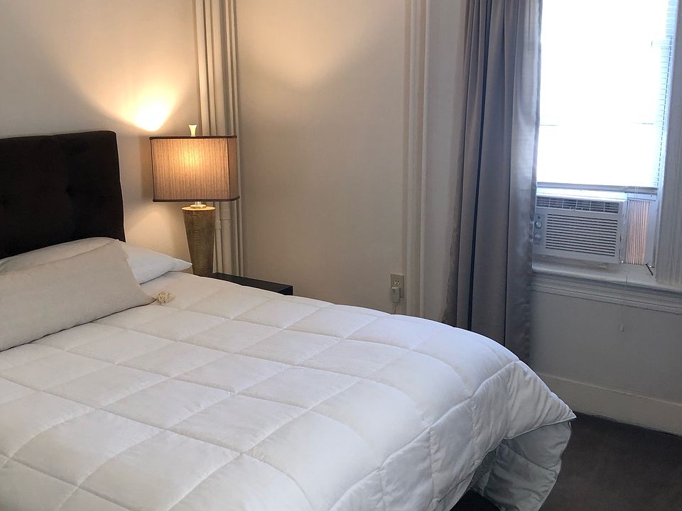 Bedroom with window AC and huge closet.