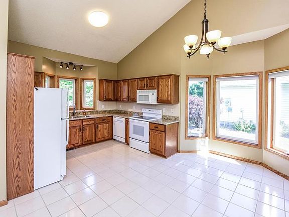 Tile kitchen and dining area with bay window