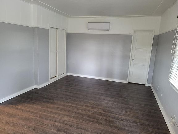 Main unit space, includes, new heating and AC wall unit, closet, door to the bathroom.