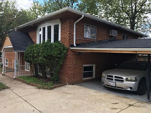 Side View with Fenced in 2 Car Carport
