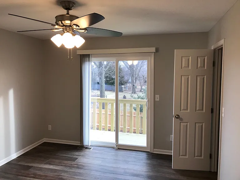 Bedroom with slider and walk in closet