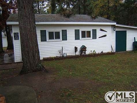 side of garage with work room door