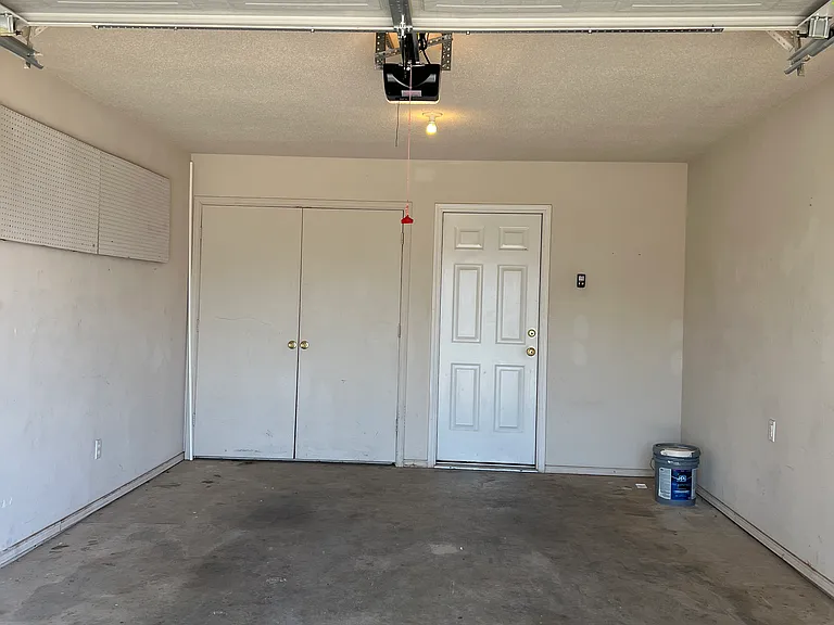 Oversized Garage, complete with garage door opener. No more hot car seats or steering wheels. Protect your vehicle against inclement weather/hail. Garage door entry into the house allow quick access to kitchen when unloading groceries.