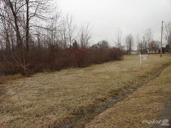 Utility pole right corner southeast boundary.