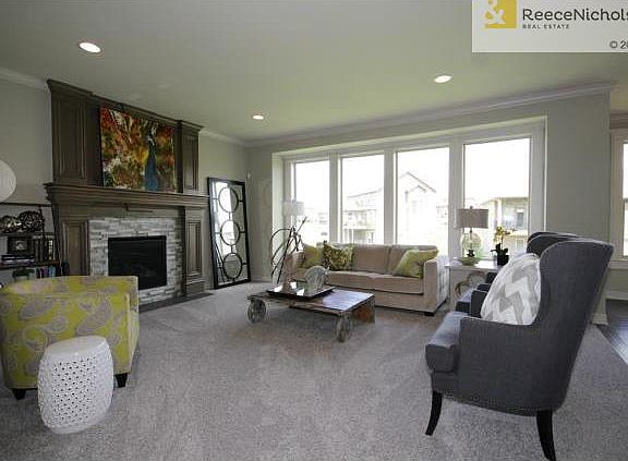 Great room with gas fireplace & natural light!