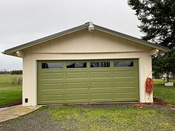 Detached garage with small shop space in the back.