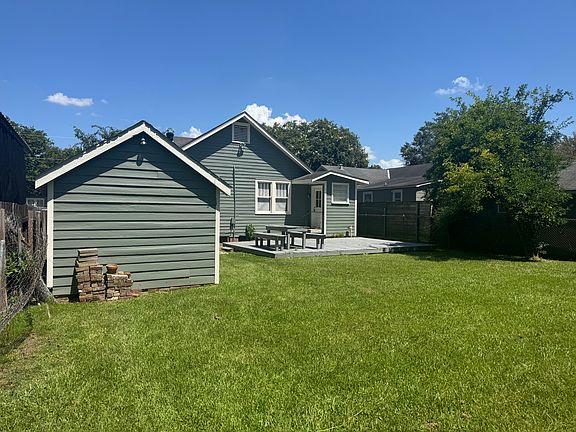 Backyard facing home, gated yard for dogs and kids to play