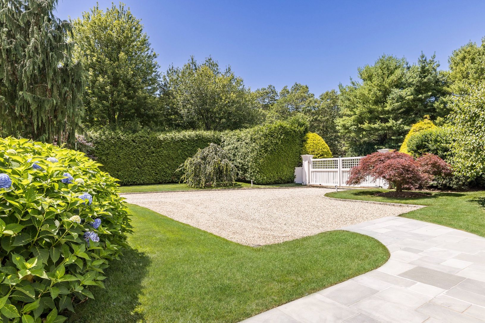 Gated entrance, hedged for privacy