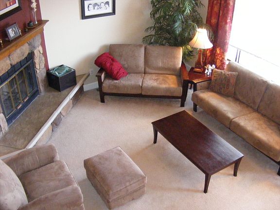 Looking down at the living room from midway up that front stairs