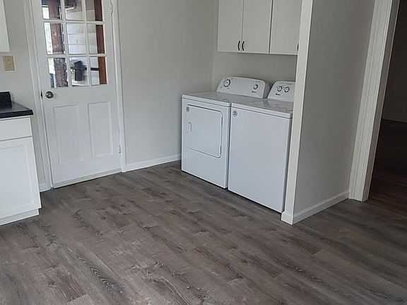 Washer/dryer storage area and rear entry in kitchen