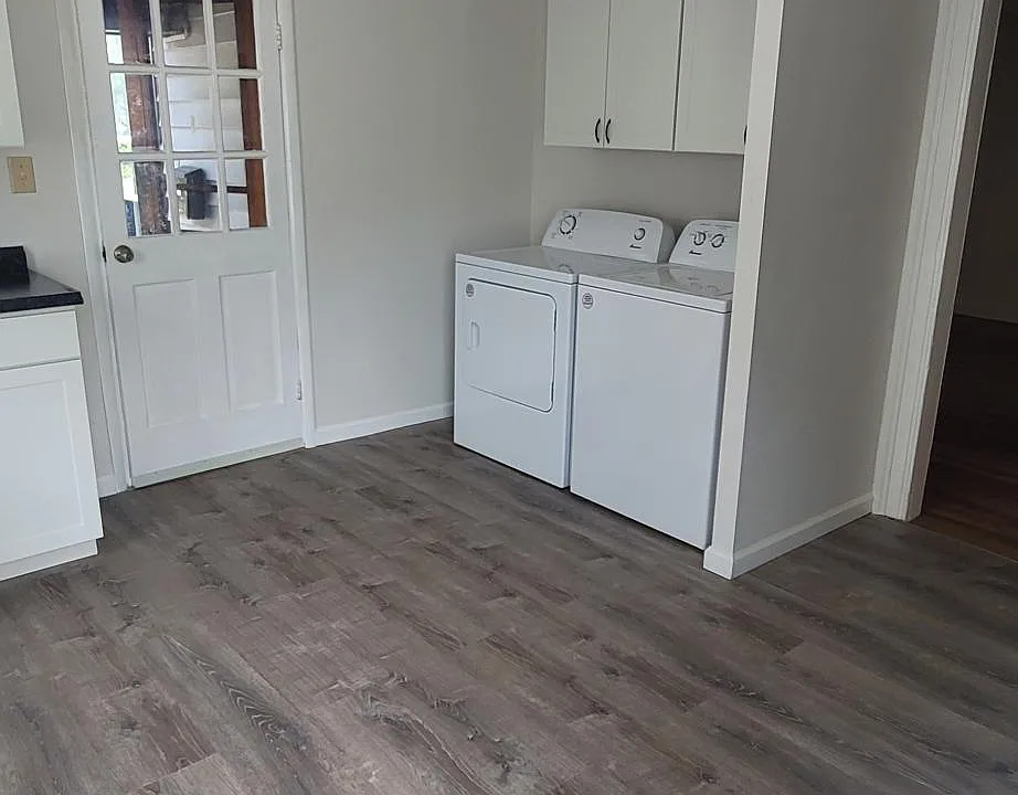 Washer/dryer storage area and rear entry in kitchen