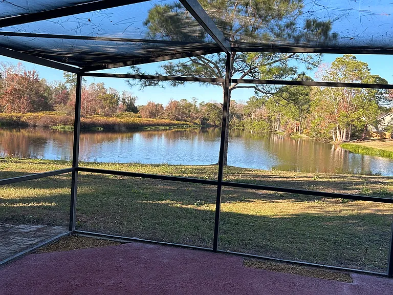 The lake is just steps from your back screened room.
