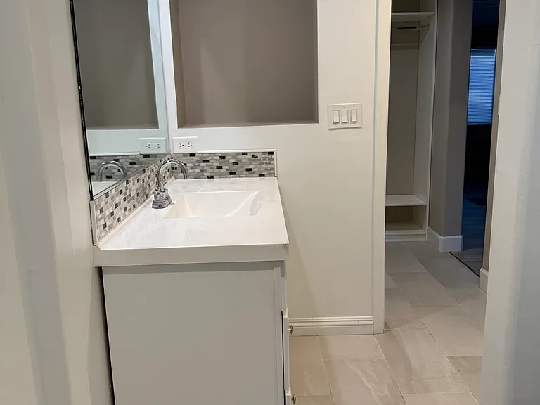 Updated vanity area with built-in shelving