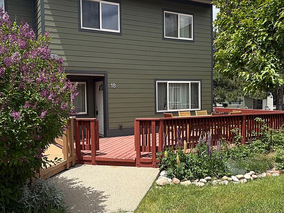 End unit with grassy areas in front and side.