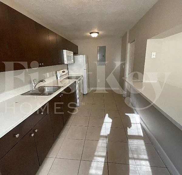 5980 NW 24th Ct — Photo 7