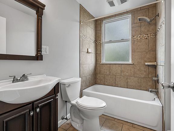 Updated modern bathroom with full tub and shower