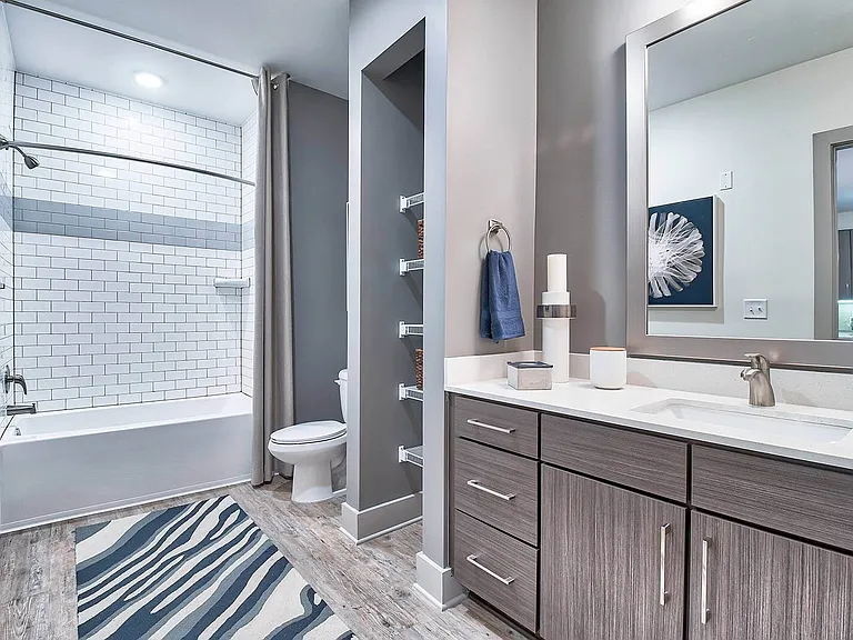 Bathrooms with modern fixtures and ample storage
