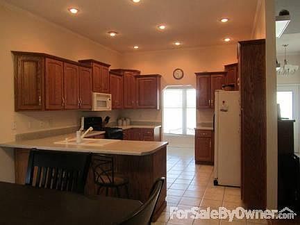 Kitchen
						:
						Oak cabinets, eat-in kitchen, bar.
