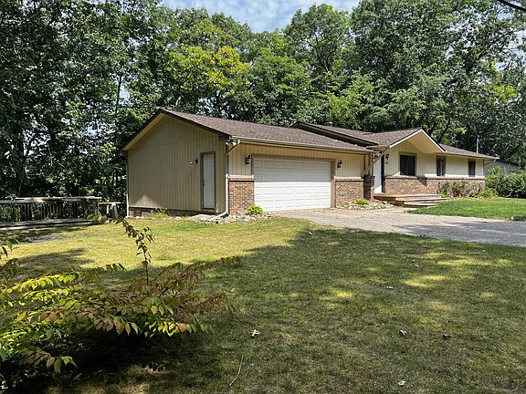 Large yard with second deck and area for a fire pit